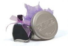 Ink in collectible bottle and metal case from France by J. Herbein